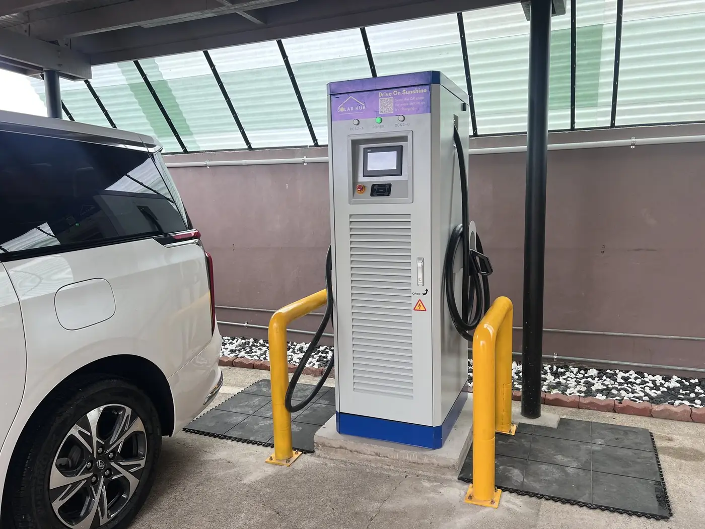 A Solar Hub Fiji DC fast EV charger charging an electric vehicle