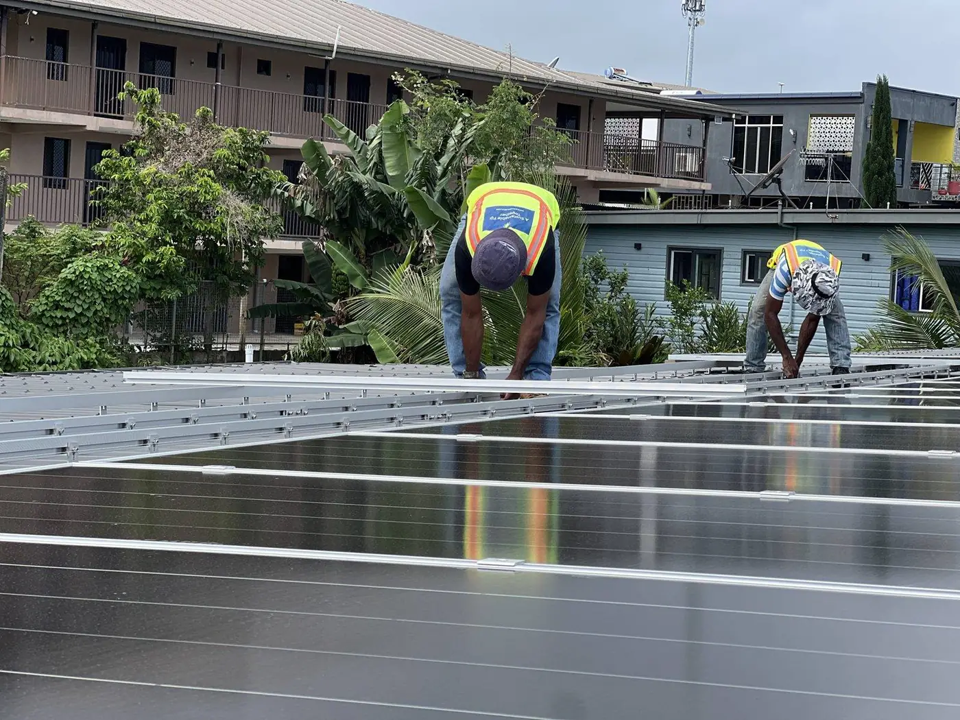 Solar Hub Fiji crew installing mounting rails