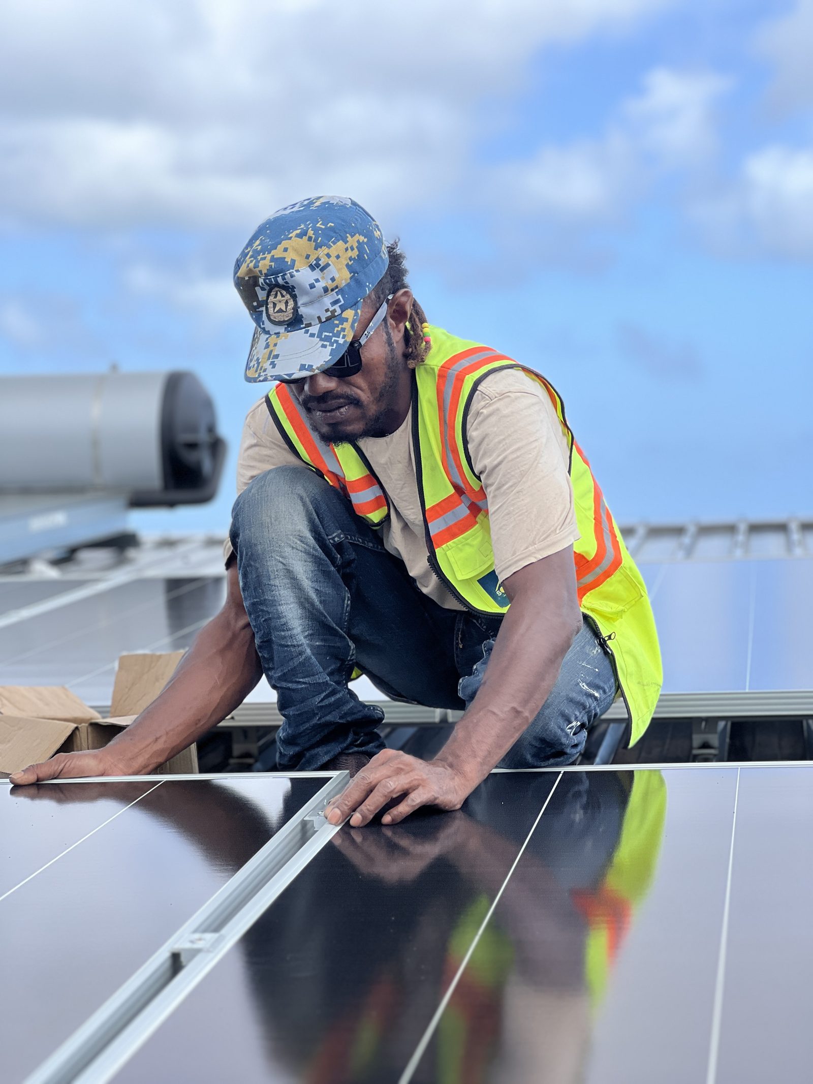 A Solar Hub Fiji installer fitting a solar panel