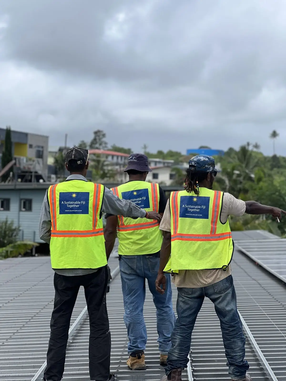 Solar Hub Fiji install crew on a rooftop